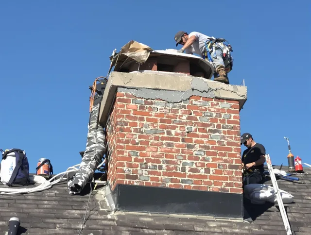 Bay Village Chimney Sweep installing a custom chimney crown in Bay Village, OH