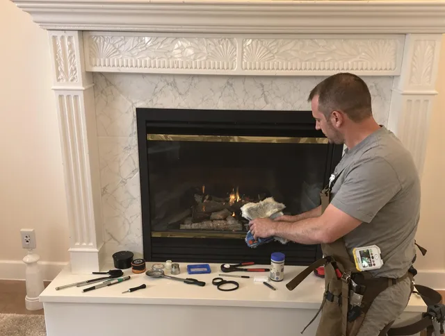 Bay Village Chimney Sweep performing fireplace maintenance in Bay Village, OH