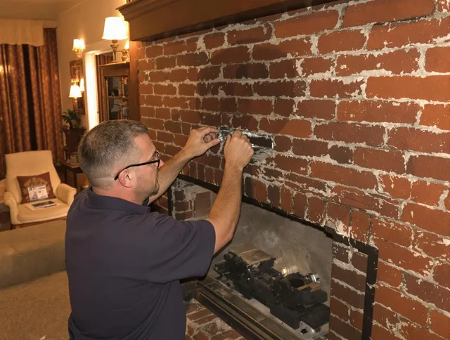 Bay Village Chimney Sweep expert fixing a fireplace in Bay Village, OH